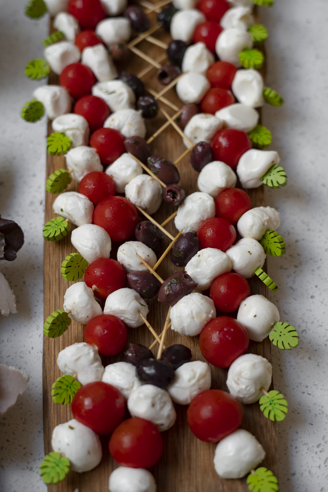 mozzarella with cherry tomatoes and olives canape canapes West Sussex, Surrey, catering, Horley, Horsham, Brighton, East Sussex, Fresh, party food, funeral, Birthday party Christening parties wedding celebration baby shower afternoon tea corporate charity event events red carpet, conferences, awards, ceremonies, meetings, Christmas, summer parties,