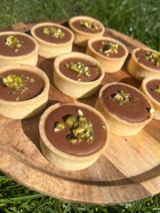 mini chocolate and coffee mousse with pistachio cream mini pidy pistachio cream with chocolate and coffee mousse birthday mothers day catering buffet party food Crawley Horsham Horley Haywards Heath Copthorne homemade food West Sussex Surrey Brighton canape